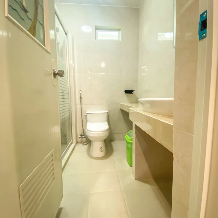 Deluxe Studio Room with queen bed, bunk bed, Smart TV, and kitchenette at Vera Cruz Apartelle in Tagbilaran City, Bohol