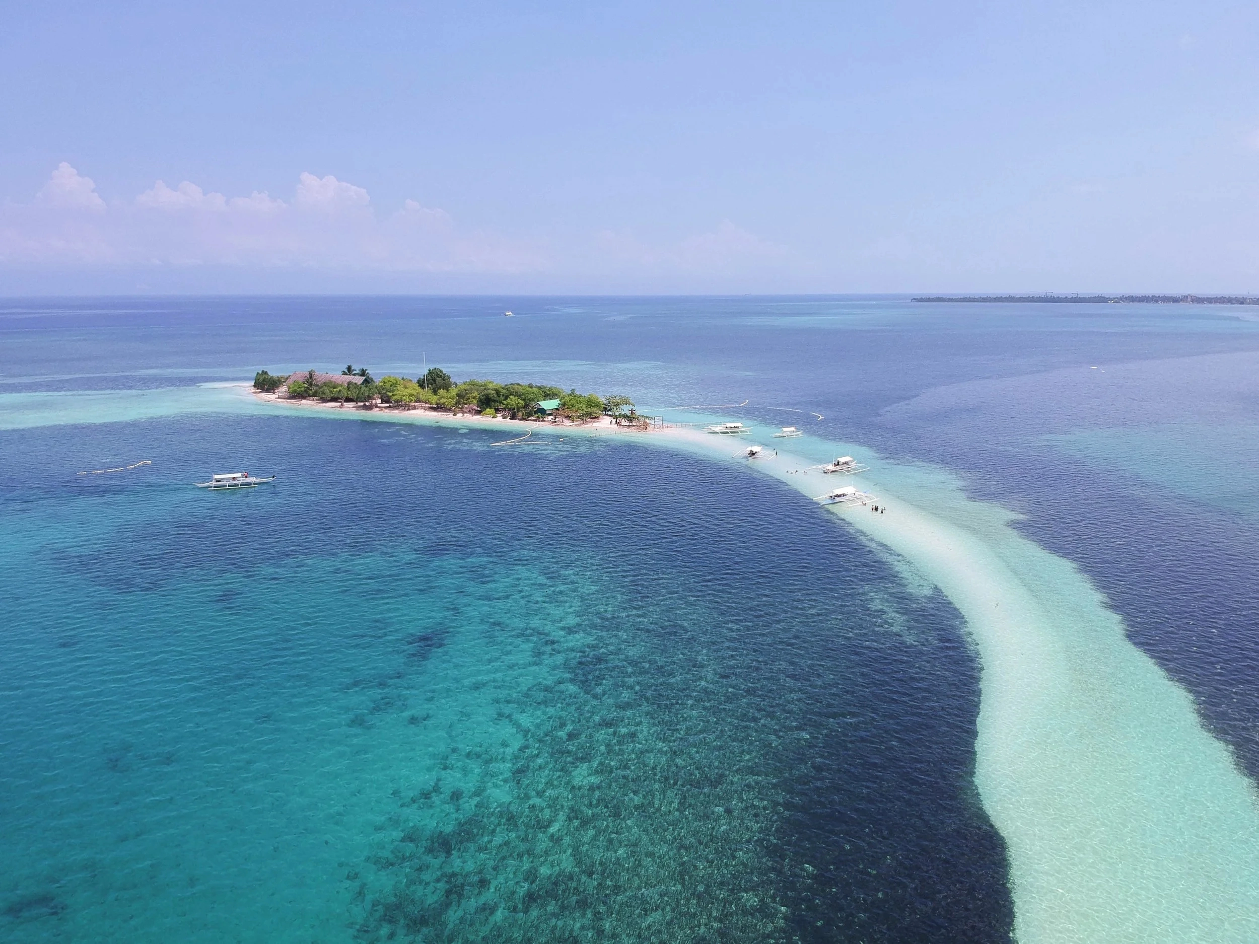 Crystal-clear waters surrounding Virgin Island Sandbar in Bohol